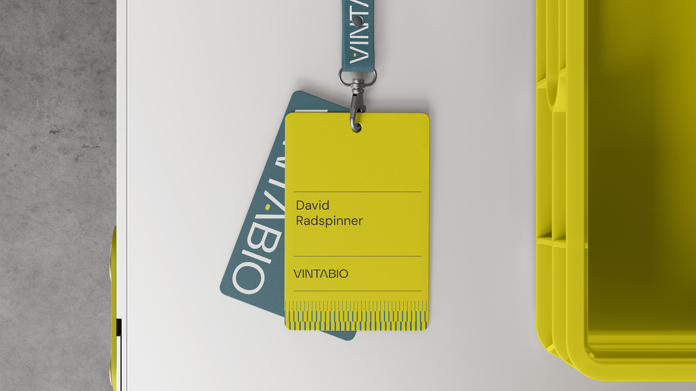 Security badge for VintaBio designed by Igawa Design, featuring bold yellow and teal colors, clean typography, and branded elements.